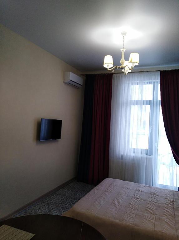 TV a/nebo společenská místnost v ubytování zhk Santorini