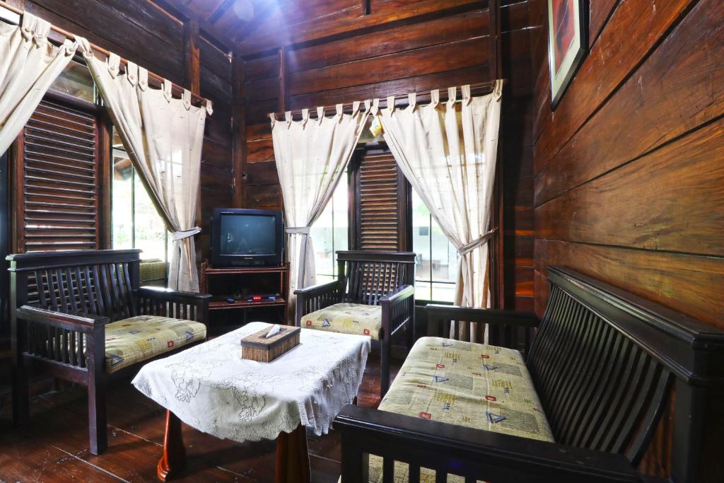 TV a/nebo společenská místnost v ubytování Negla Beach Villa