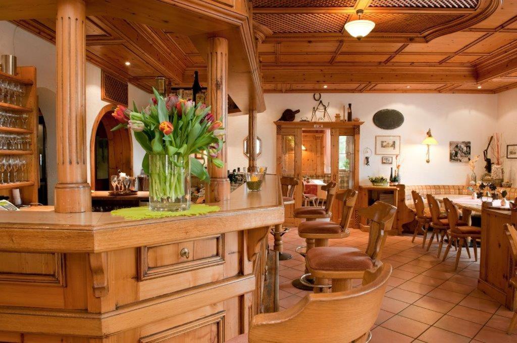 a kitchen with a counter with a vase of flowers at Wein- und Sekthaus F.B.Schönleber in Oestrich-Winkel