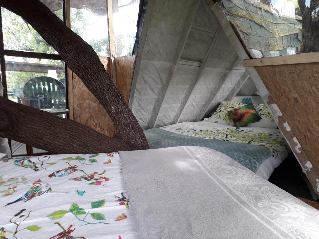 Postel nebo postele na pokoji v ubytování B&B La Cabane Insolite