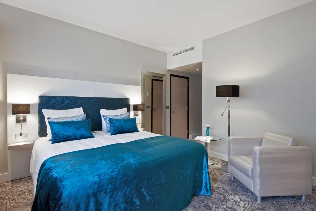 Postel nebo postele na pokoji v ubytování Van der Valk Hotel Leiden