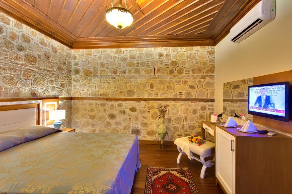 Postel nebo postele na pokoji v ubytování Dogan Hotel