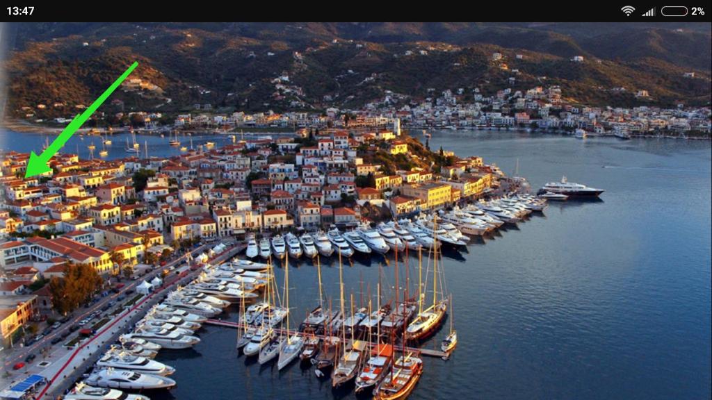 an aerial view of a harbor with boats in the water at CENTRAL TOWN STUDIO ON POROS in Poros
