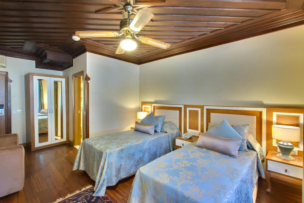 Postel nebo postele na pokoji v ubytování Dogan Hotel