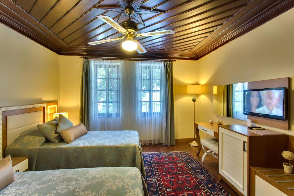 Postel nebo postele na pokoji v ubytování Dogan Hotel