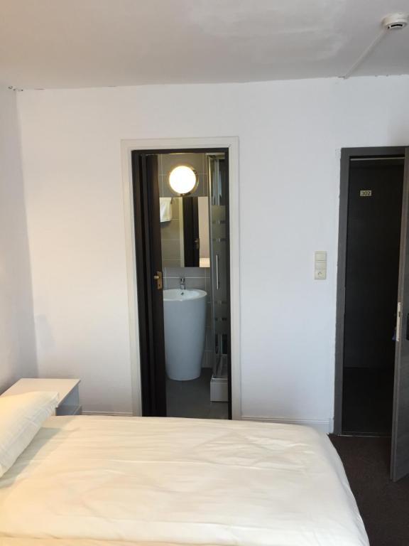 Postel nebo postele na pokoji v ubytování Hotel Bouillon