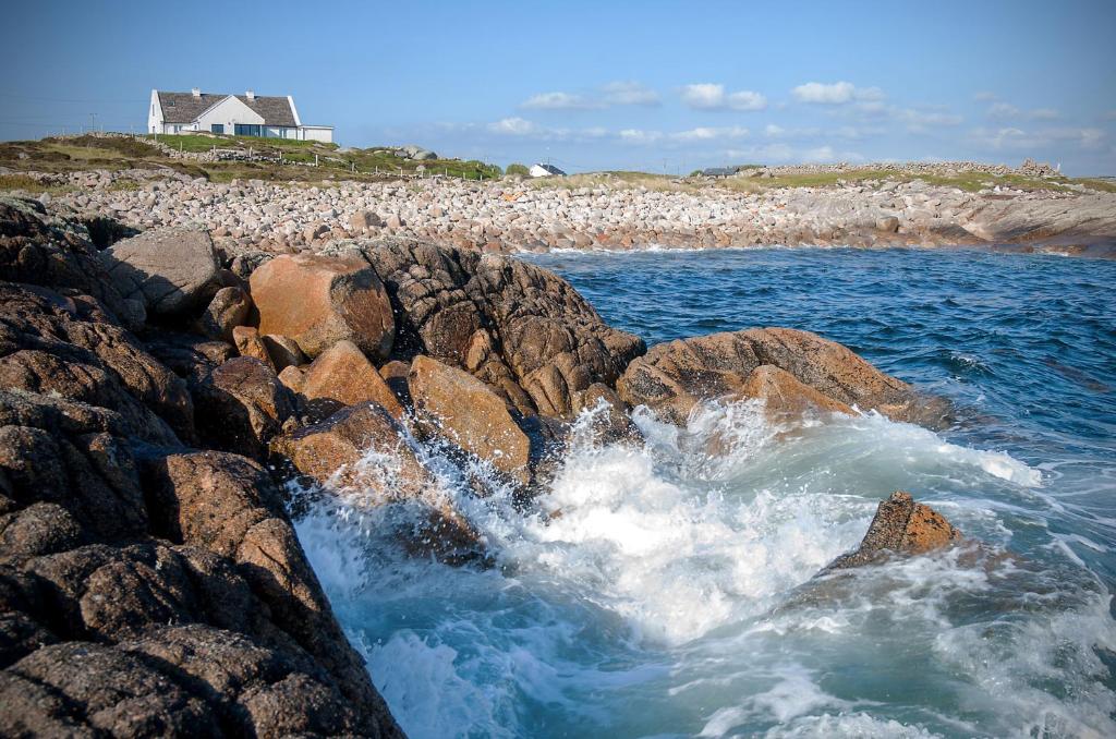a group of waves crashing on a rocky beach at Cottage 215 - Claddaghduff in Cleggan