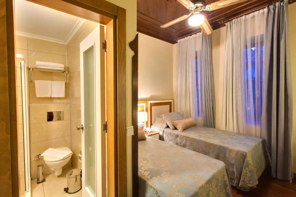 Postel nebo postele na pokoji v ubytování Dogan Hotel
