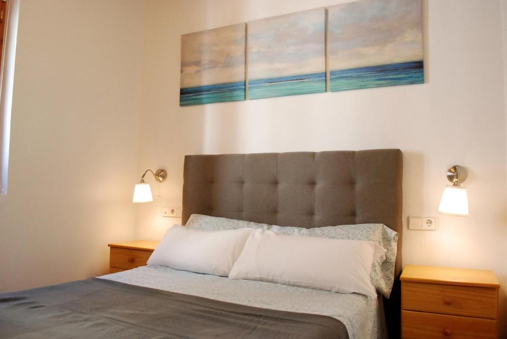 Postel nebo postele na pokoji v ubytování Vlc Apartaments