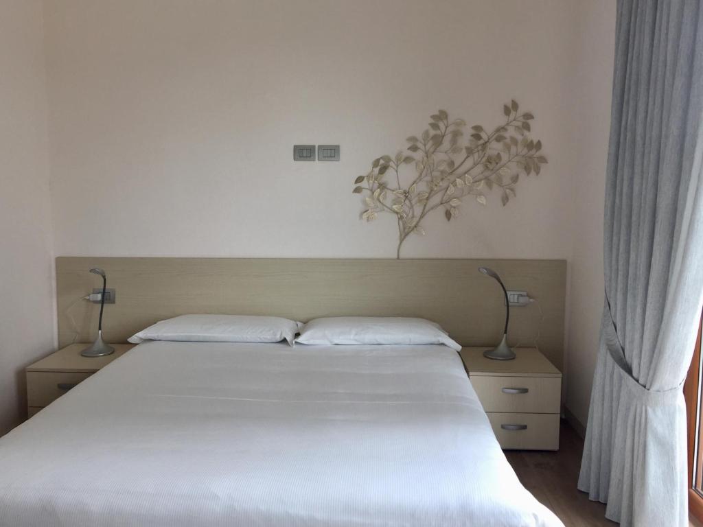 Postel nebo postele na pokoji v ubytování Vittoria Residence