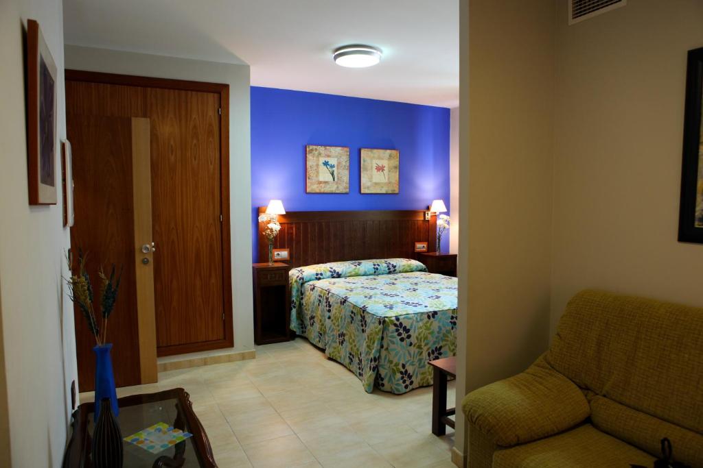 Postel nebo postele na pokoji v ubytování Hotel Rocio
