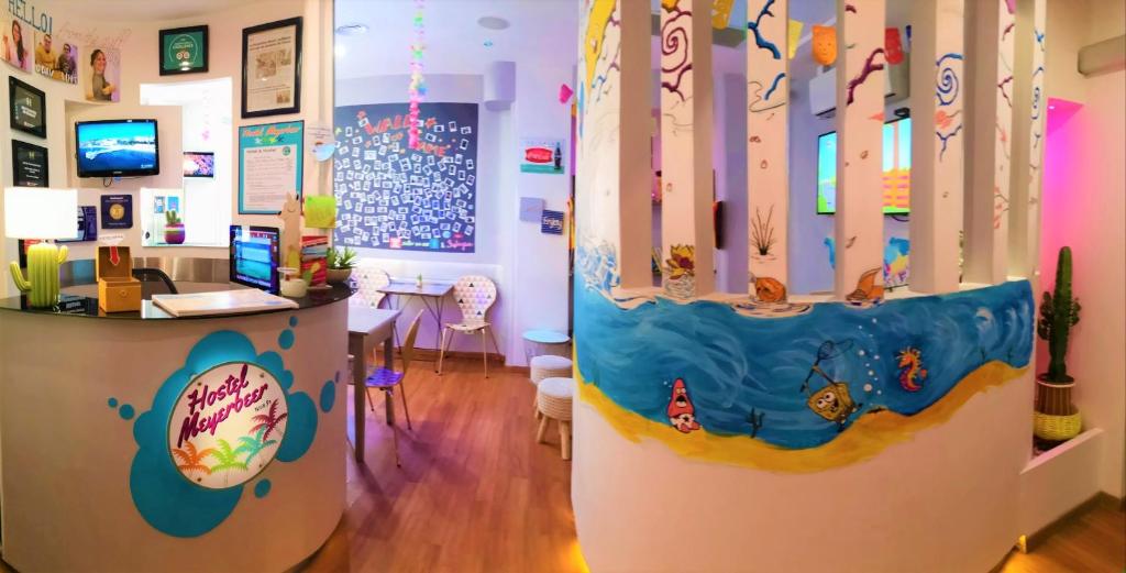 TV a/nebo společenská místnost v ubytování Meyerbeer Beach