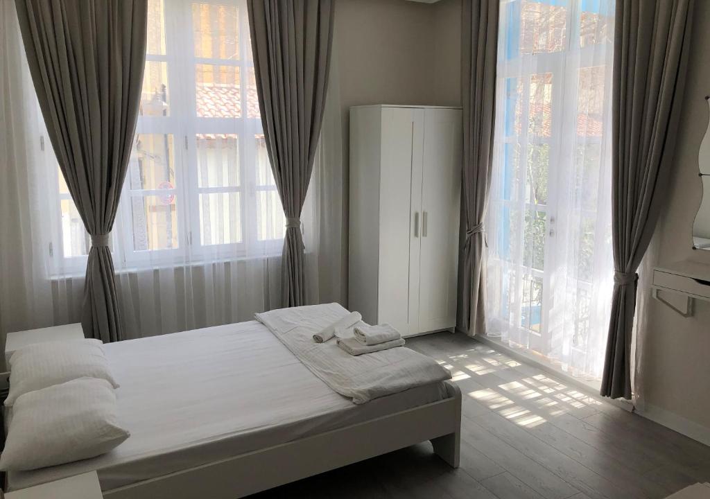 Postel nebo postele na pokoji v ubytování ATICI HOTEL