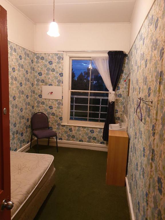 Postel nebo postele na pokoji v ubytování South Rakaia Hotel