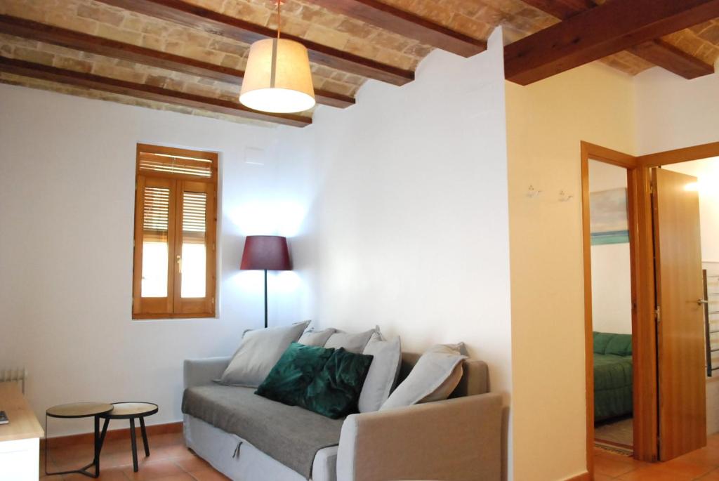 a living room with a couch and a table at Vlc Apartaments in Valencia