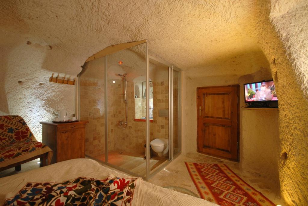 Postel nebo postele na pokoji v ubytování Arif Cave Hotel