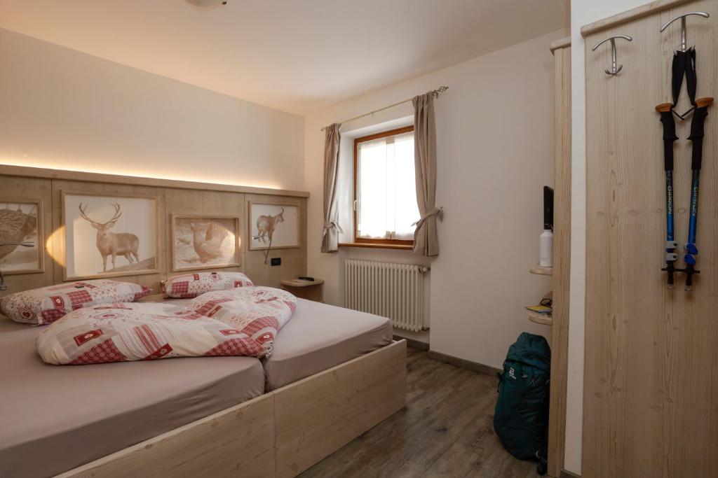 Postel nebo postele na pokoji v ubytování Albergo Aurora