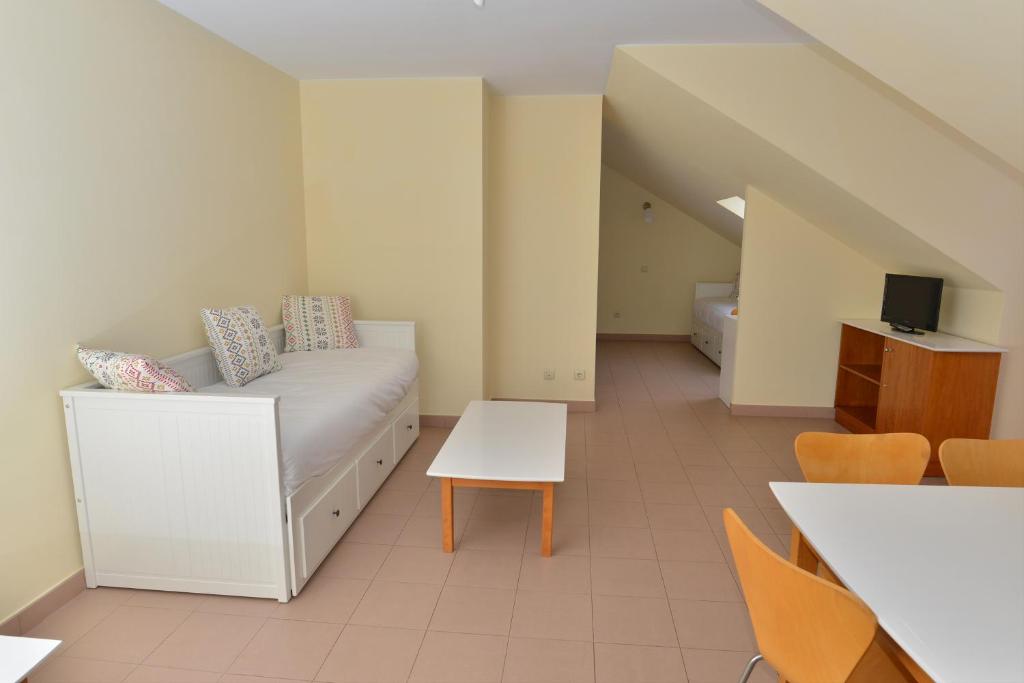 A bed or beds in a room at Apartamentos Marina