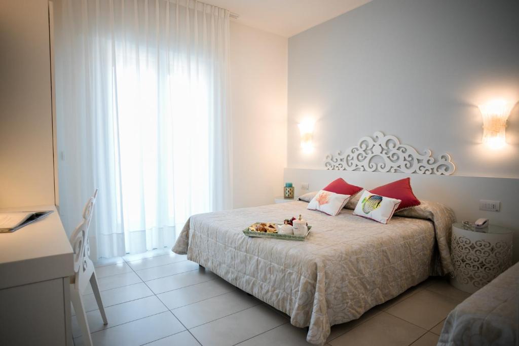 Postel nebo postele na pokoji v ubytování Hotel Albatros