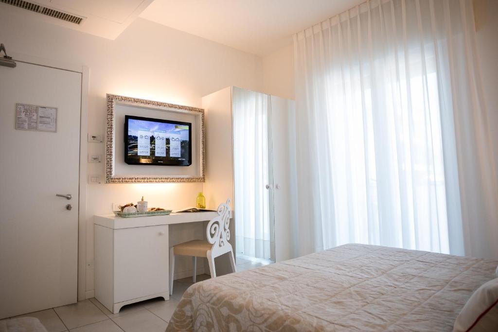 Postel nebo postele na pokoji v ubytování Hotel Albatros