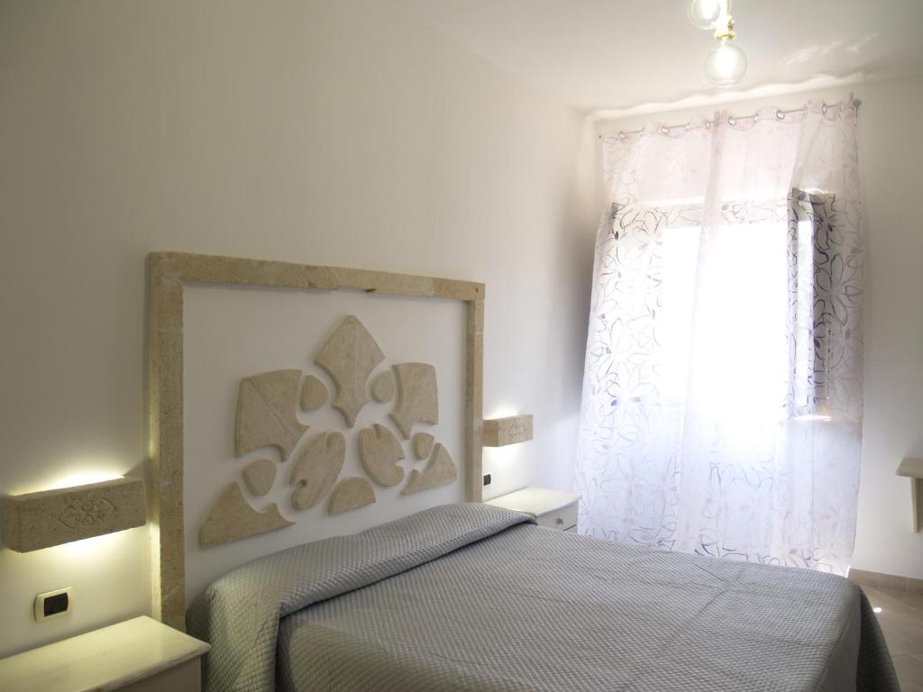 Postel nebo postele na pokoji v ubytování Masseria Don Sante