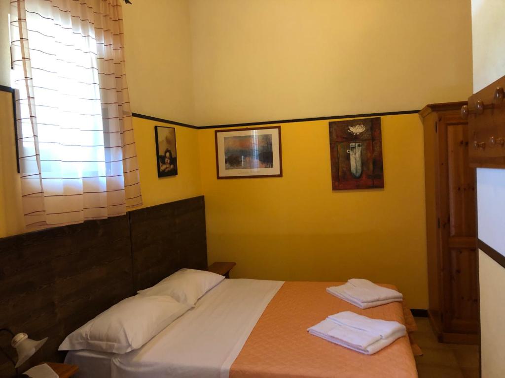 Postel nebo postele na pokoji v ubytování Agriturismo Valle di Chiaramonte