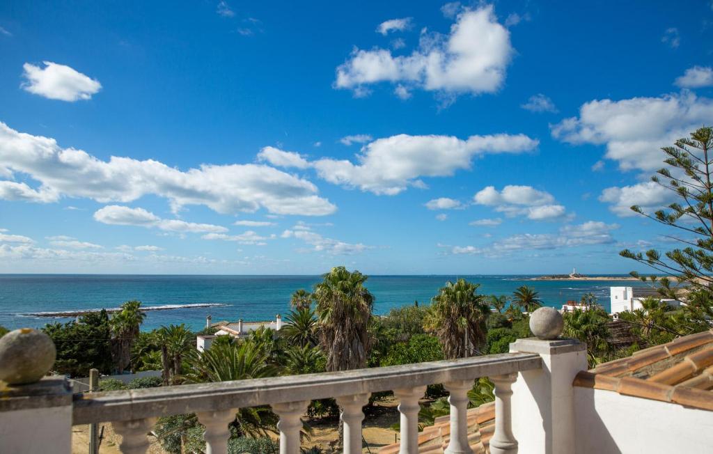 a view of the ocean from a balcony at Villa Atlántico in Los Caños de Meca
