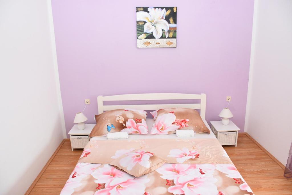 Postel nebo postele na pokoji v ubytování Apartments Piccolo Piaccere