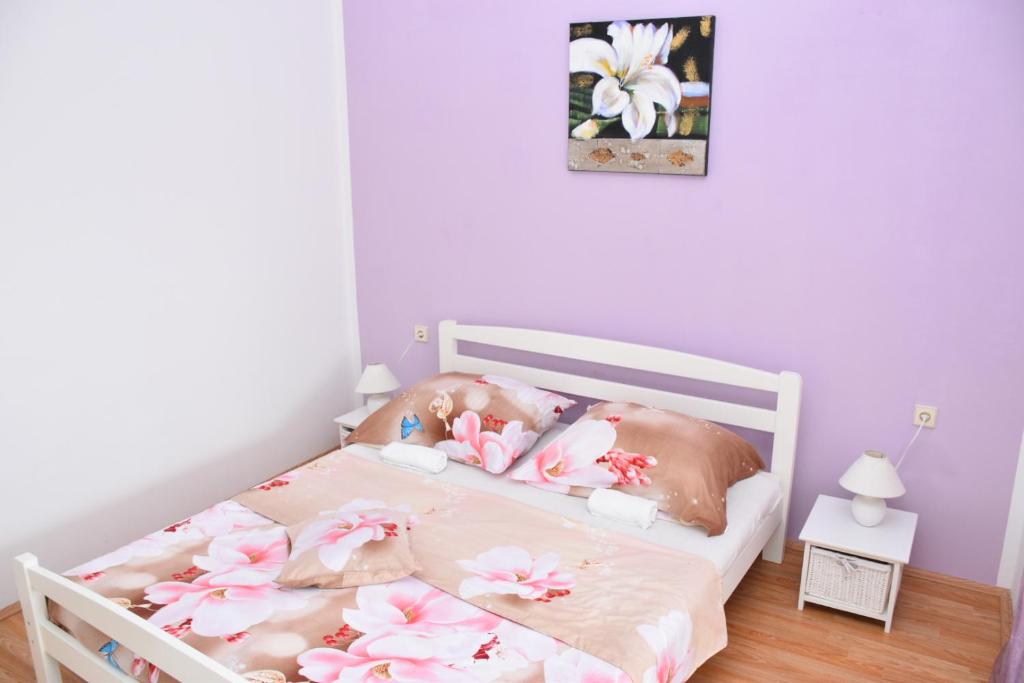 Postel nebo postele na pokoji v ubytování Apartments Piccolo Piaccere
