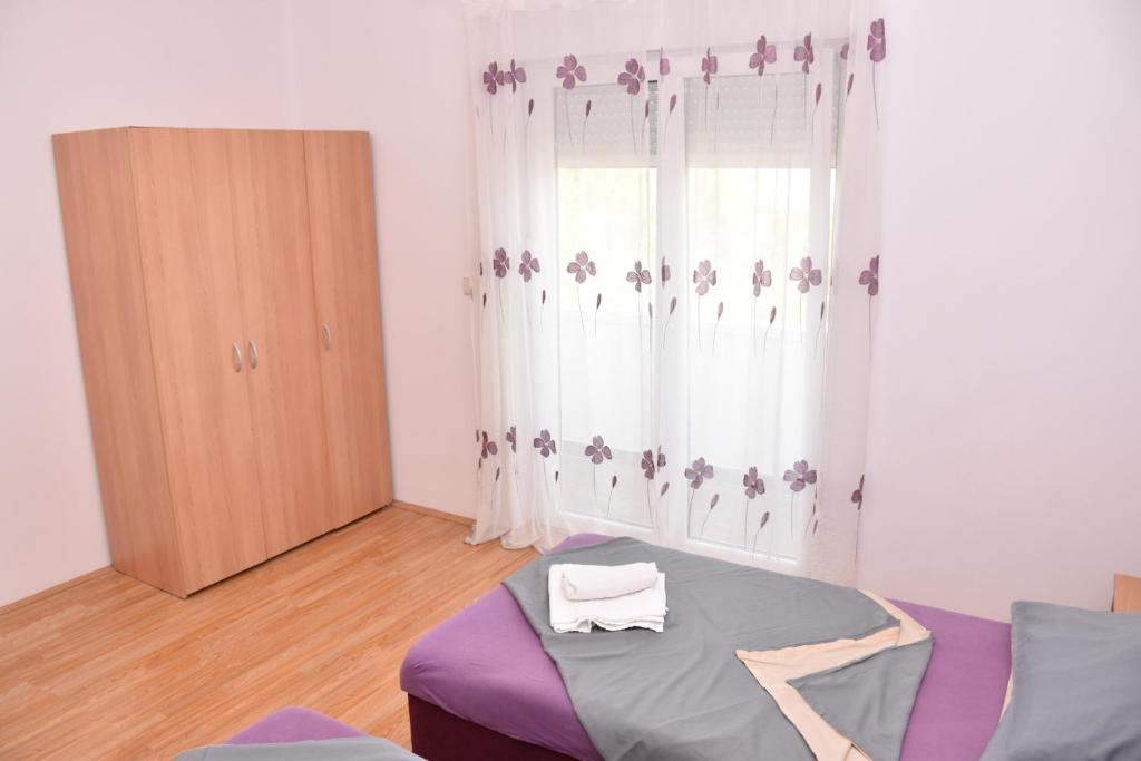 Postel nebo postele na pokoji v ubytování Apartments Piccolo Piaccere