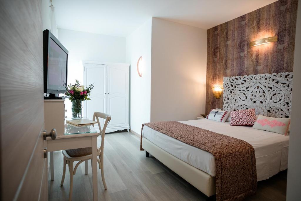 Postel nebo postele na pokoji v ubytování Hotel Albatros