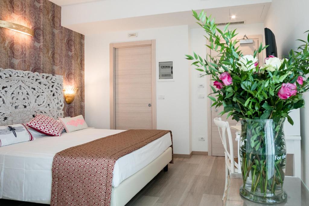 Postel nebo postele na pokoji v ubytování Hotel Albatros