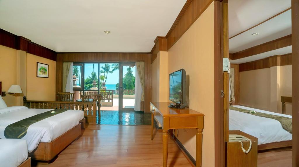 Postel nebo postele na pokoji v ubytování Aloha Resort