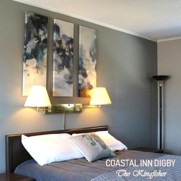 Säng eller sängar i ett rum på Coastal Inn Digby