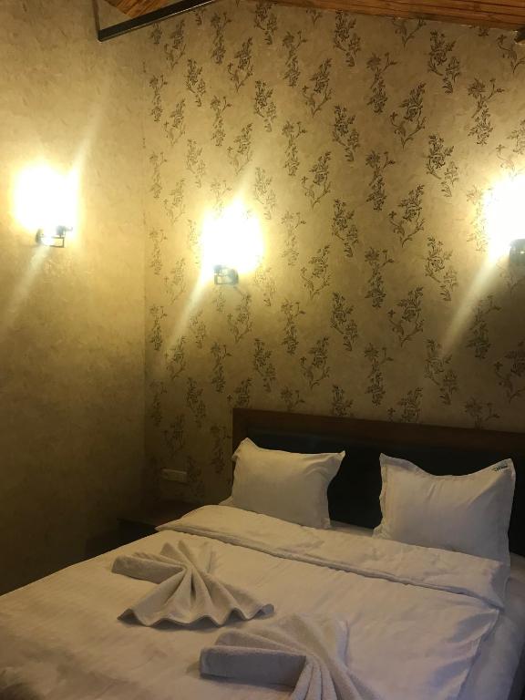 Postel nebo postele na pokoji v ubytování Eridana Hotel