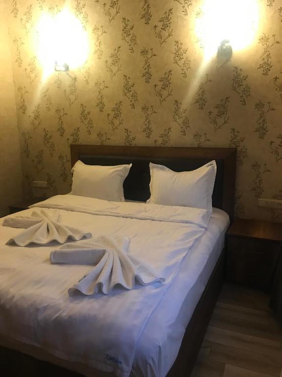 Postel nebo postele na pokoji v ubytování Eridana Hotel