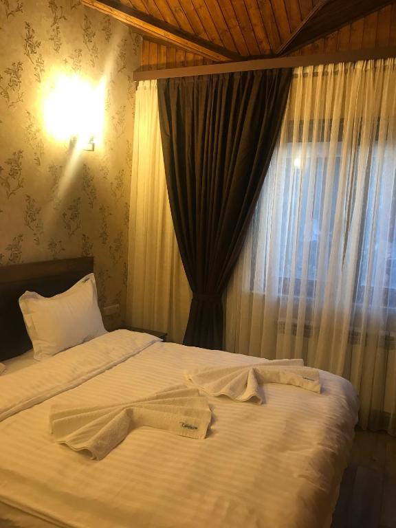 Postel nebo postele na pokoji v ubytování Eridana Hotel