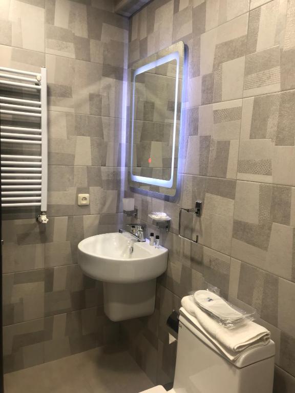 Koupelna v ubytování Eridana Hotel