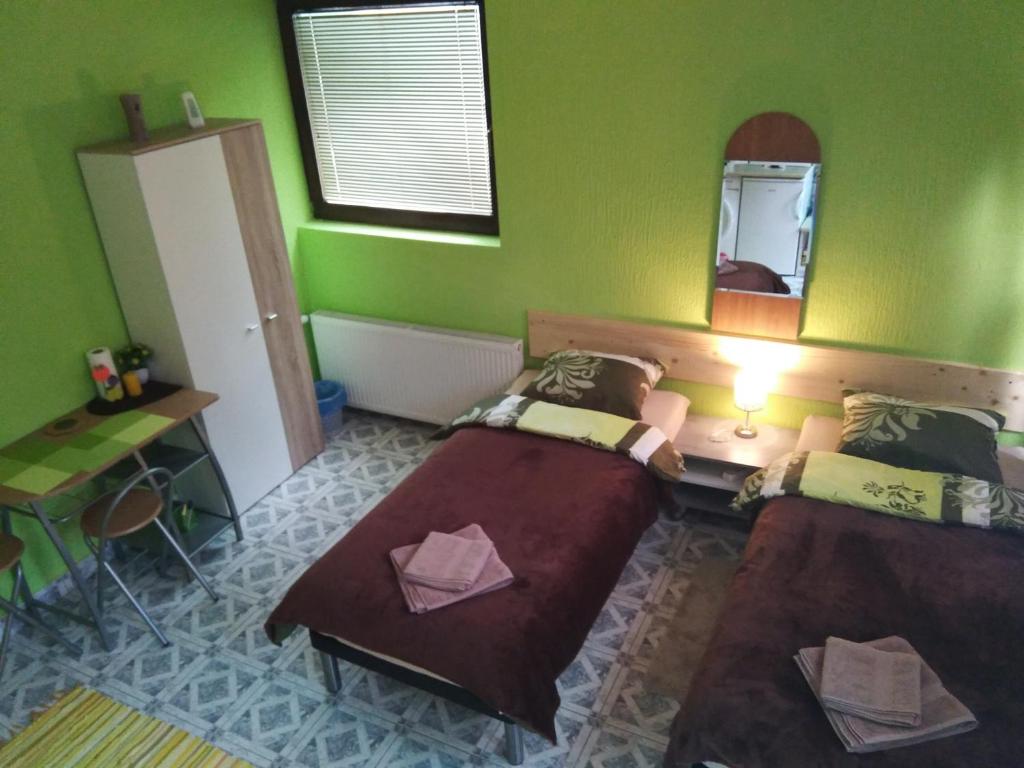 Postel nebo postele na pokoji v ubytování Apartments Barocco