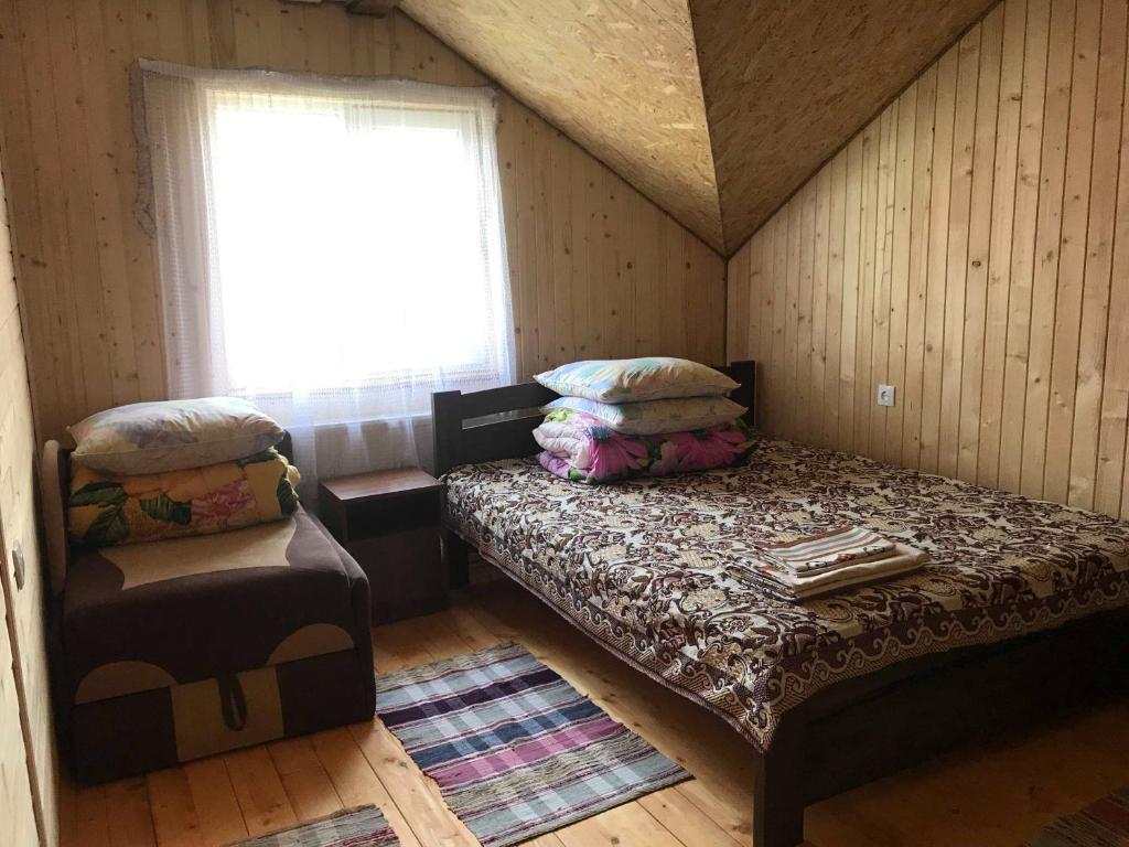 Postel nebo postele na pokoji v ubytování Rukavichka