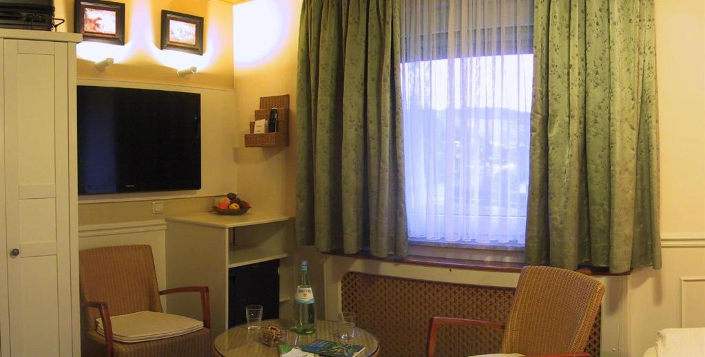 TV a/nebo společenská místnost v ubytování Pension Zum Golfstübchen