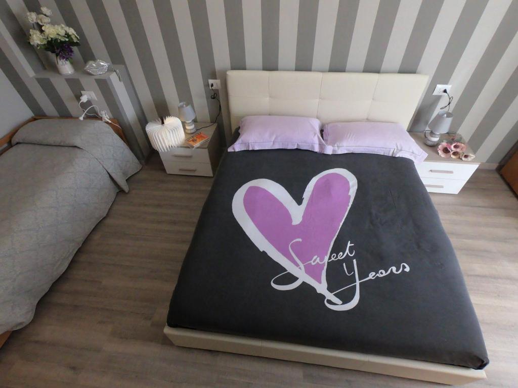 Łóżko lub łóżka w pokoju w obiekcie La Casetta Narni