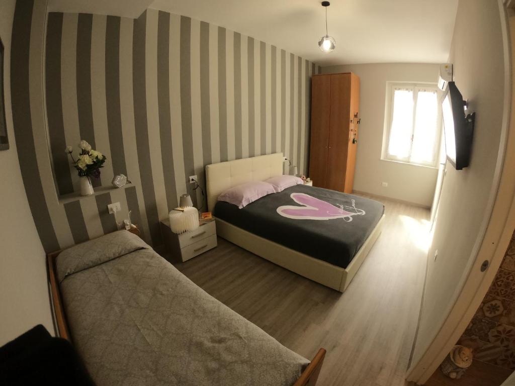 Łóżko lub łóżka w pokoju w obiekcie La Casetta Narni