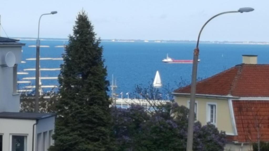 a view of the water with a boat in the water at Dojlidzka Chata in Gdynia