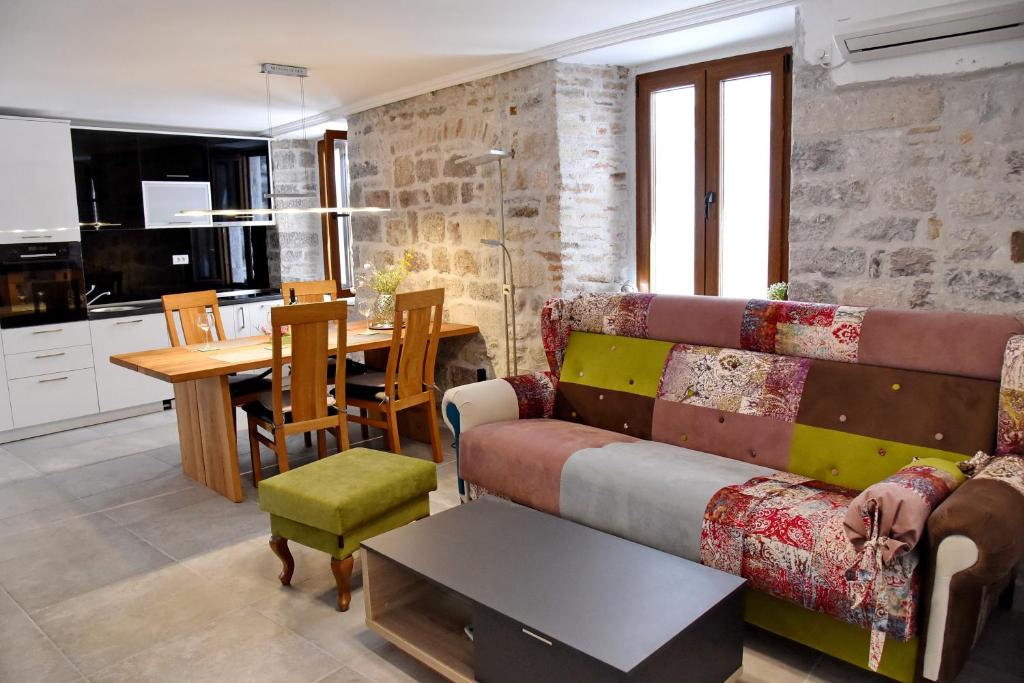 a living room with a couch and a table at Lana & Ena Apartments in Kotor
