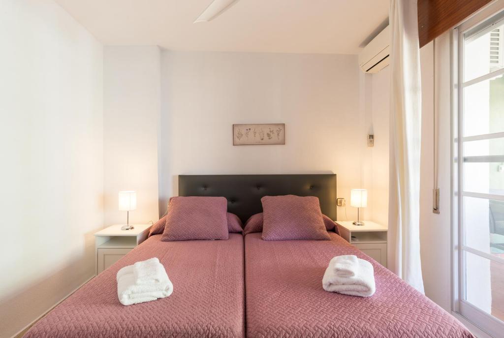 Posteľ alebo postele v izbe v ubytovaní Sandy Playa Golf Málaga con Parking