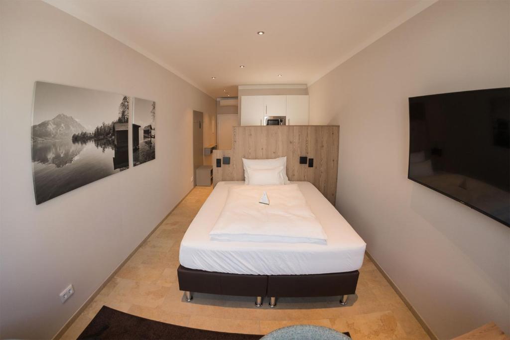 Letto o letti in una camera di TT Aparthotel Neuhofen