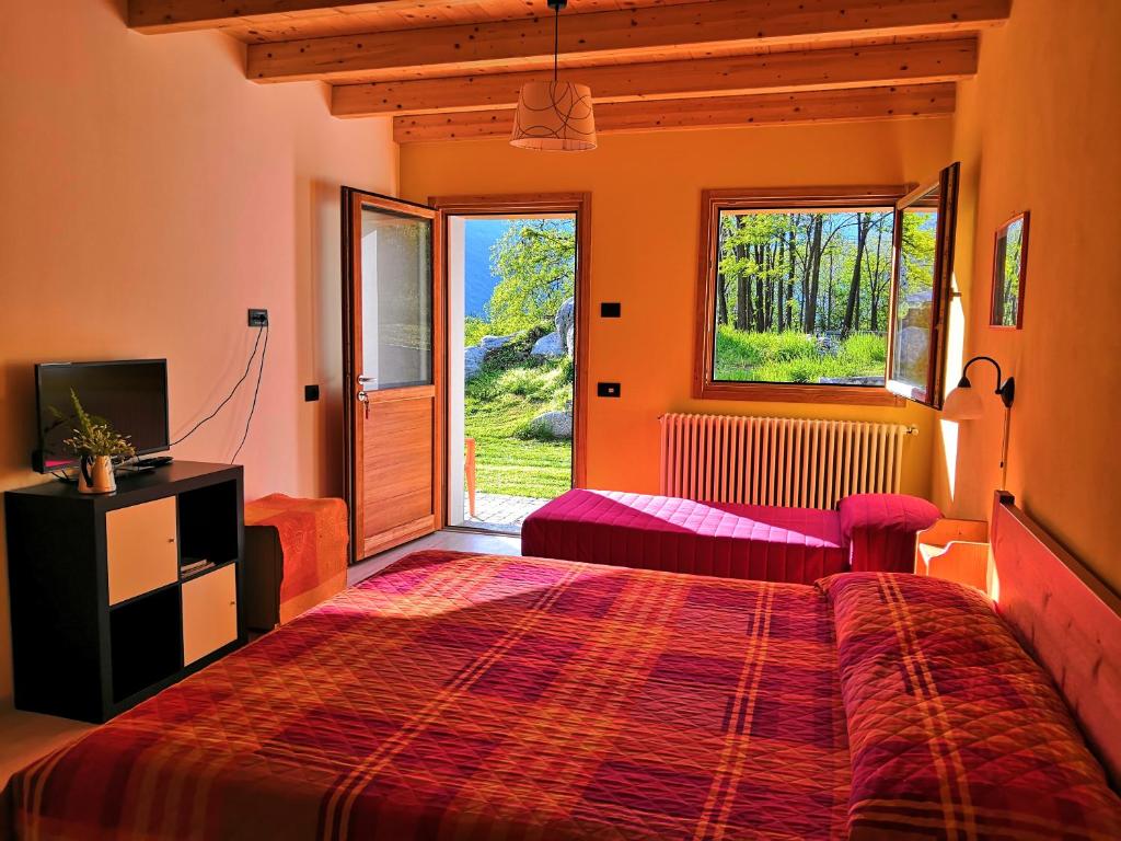 Postel nebo postele na pokoji v ubytování Agriturismo Val Codera