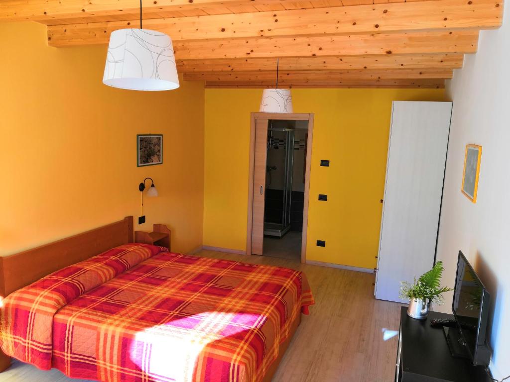 Postel nebo postele na pokoji v ubytování Agriturismo Val Codera