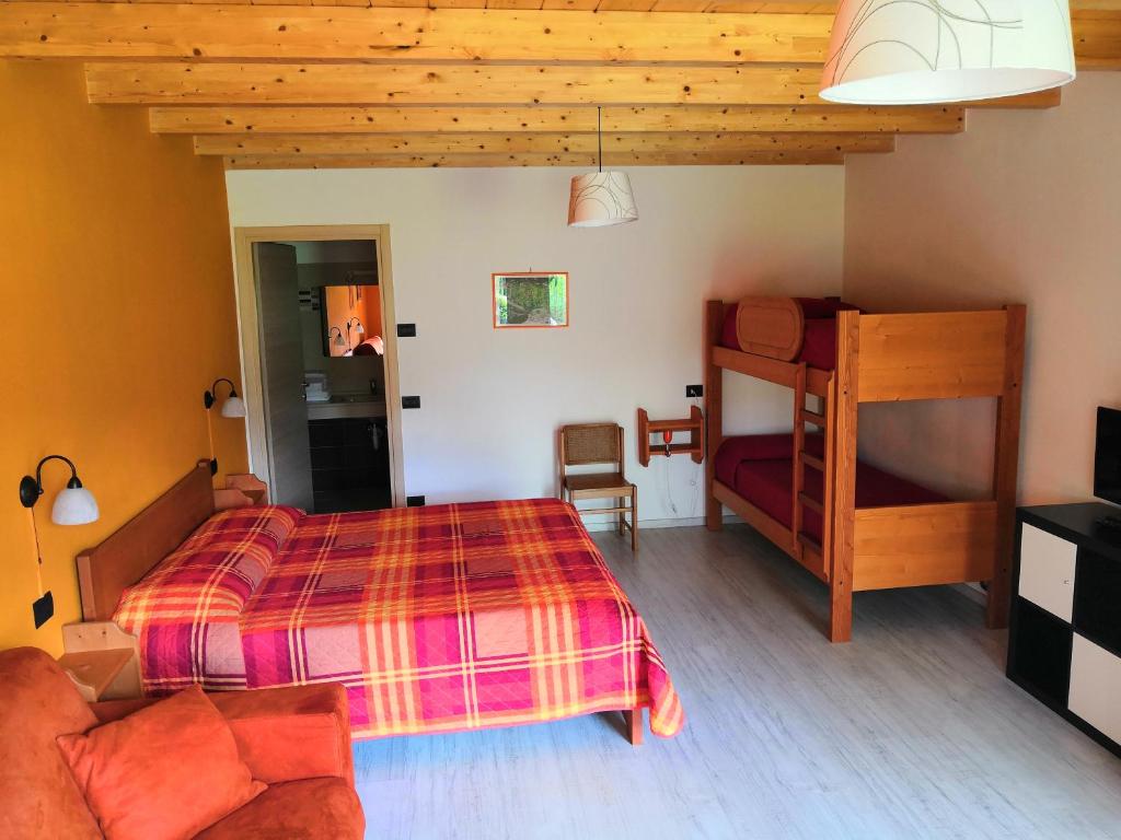 Postel nebo postele na pokoji v ubytování Agriturismo Val Codera